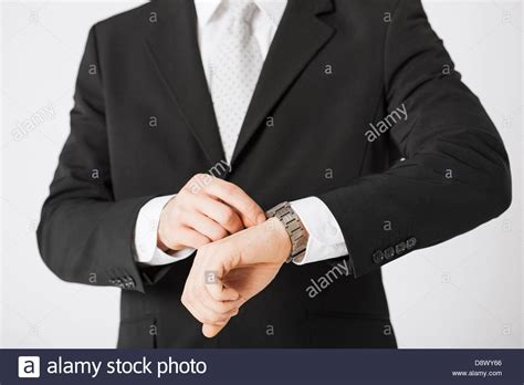 Man Looking At Wristwatch Stock Photo Alamy