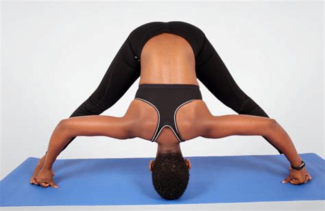 Fitness Woman Doing Wide Legged Forward Bend Yoga Pose