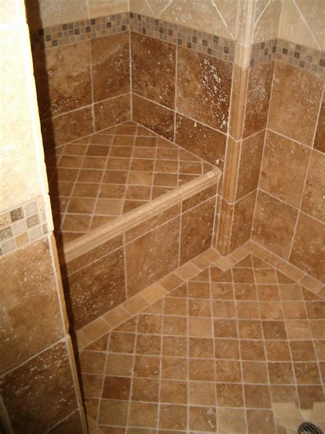 You can also match a backsplash on the bathroom vanity to the tile in your shower. tile designs for showers 2017 - Grasscloth Wallpaper