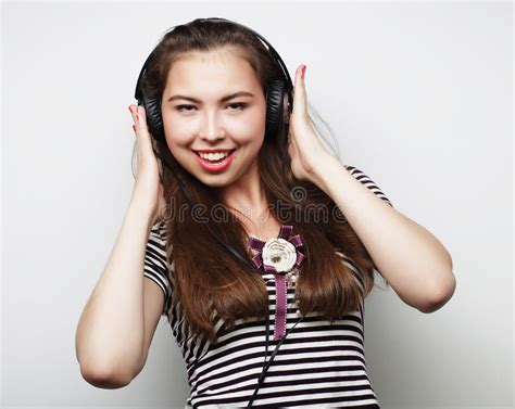 Young Woman Listening To Music Happy And Headphones Stock Photo