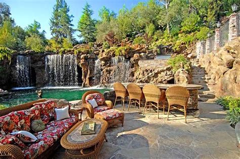 A Luxurious Pool With A Waterfall And A Cave At Old Lion