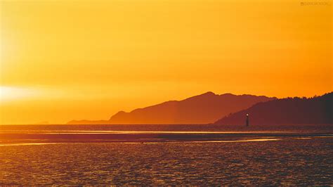 Hd Wallpaper Yellow Sunset Lighthouse 5k Scenic Sky