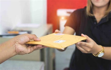 Male Hand Send Mail Envelope To The Female Of Post Office Before