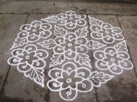 The patterns at the corners are one of my favourites, beautiful aren't they. S.No. 41 :-21-11 pulli kolam- interlaced dots kolam ...