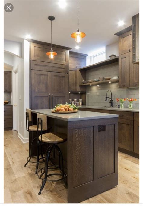 The oslo gray cabinets provide the perfect contrast between the light wood floors, white backsplash, and white ceiling. Brown cabinets with grey countertops | Dark wood kitchen ...
