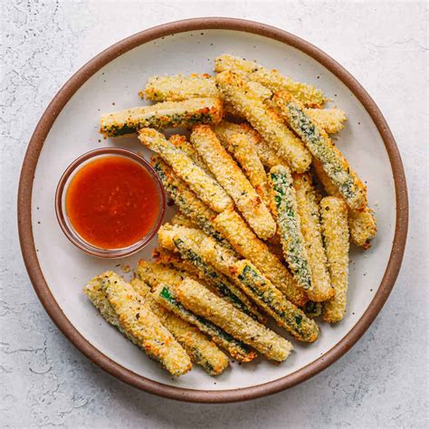 Salting and sweating the zucchini before frying pulls most of the extra moisture from the zucchini or yellow squash. Air Fryer Zucchini Fries | Posh Journal
