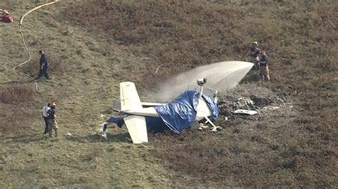 Plane Crash Kills 2 After Hitting Power Line Officials Say
