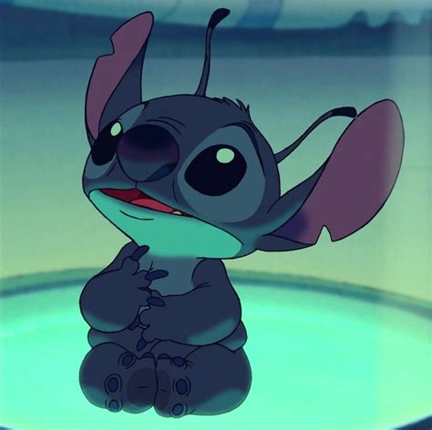 The Animated Character Stitch Is Sitting In Front Of A Glass Bowl
