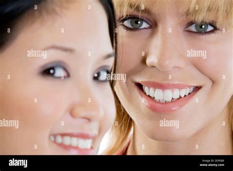 Portrait Of Two Young Women Smiling Stock Photo Alamy