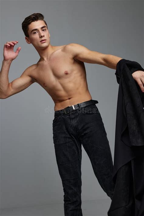 Handsome Man Nude Torso Black Shirt In Hand Studio Posing Stock Photo