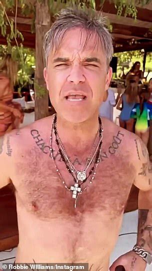 Robbie Williams Dances To Classic Abba Tune In His Swimming Trunks As He Enjoys Ibiza Express