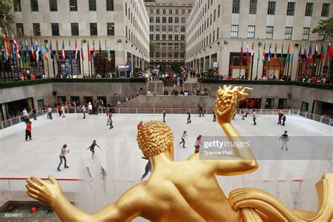 Skaters Glide Around The Rink At The Rockefeller Center Ice Rink On