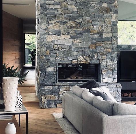 Beautiful Grey Stone Wall Wraps Around This Slow Combustion Dual
