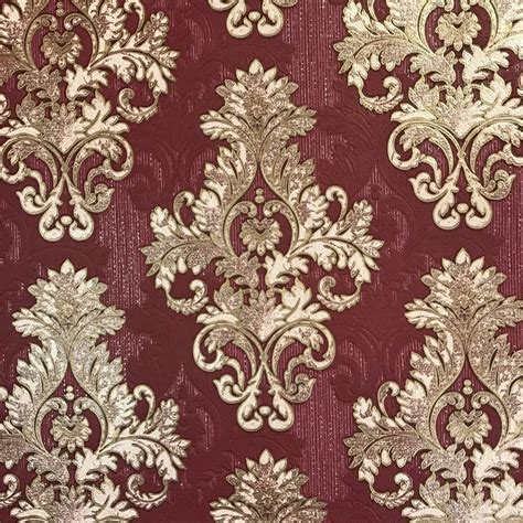 An Ornate Red And Gold Wallpaper With White Flowers On The Bottom Half