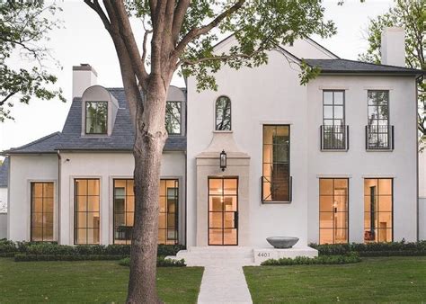 Will you be an evil or benevolent deity? Stunning 2-story white stucco modern home accented with a ...