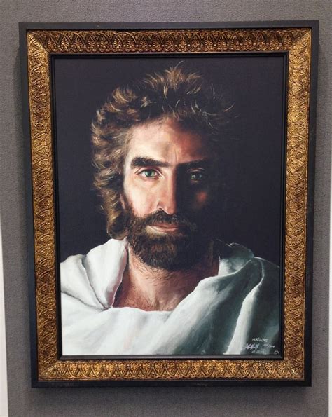A Man With Long Hair And Beard Wearing A White Shirt Is In A Gold Frame