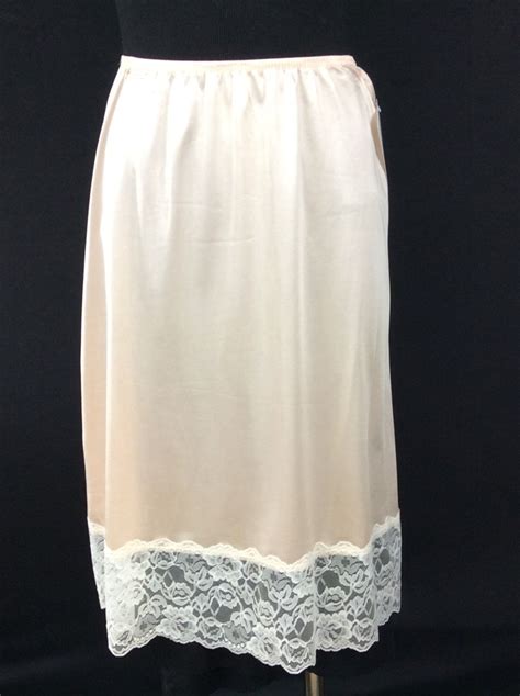vintage circa 1970 s peach nylon dress half slip with wide lace hem size medium by