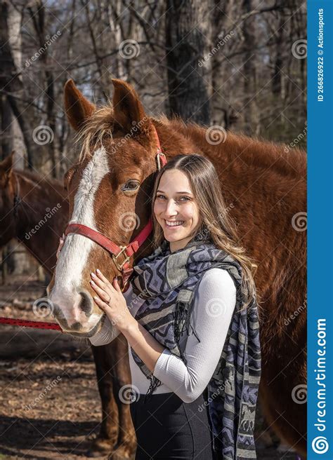 Lovely Brunette Cowgirl Enjoying A Day With Her Horse On Her Farm Stock