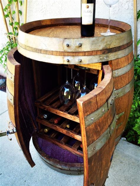 Carefully handcrafted from an authentic oak wine barrel with a professional quality finish, this cabinet is sure to be a conversation piece in your home year round. Love it! Wine Barrel Cabinet with Wine and Glass by ...
