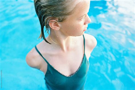 Blonde Teen Girl In Short Bob With Wet Slicked Back Hair In Pool
