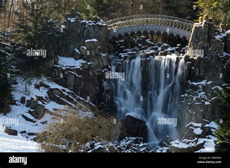 Teufelsbrucke And Waterfall In Winter Bergpark Wilhelmshohe Kassel