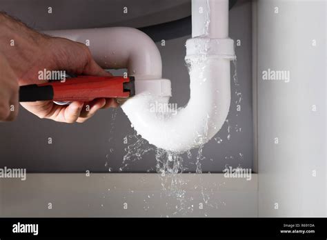 Plumber Fixing Sink Pipe With Adjustable Wrench Stock Photo Alamy
