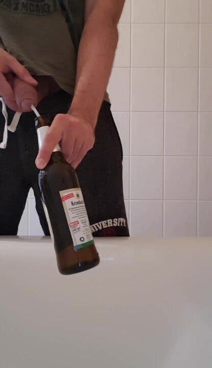 beer piss into beer bottle