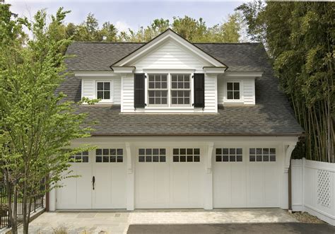 This Carriage House With Lots Of Charm And Detail Has Three Car Bays A