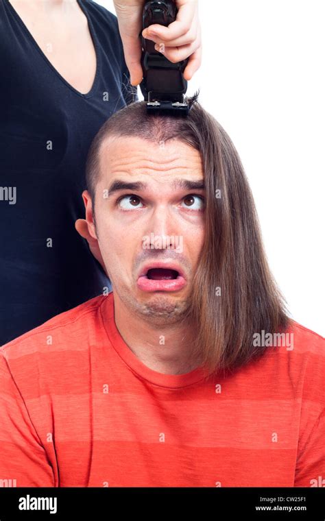 Close Up Of Shocked Long Haired Man Being Shaved With Hair Trimmer