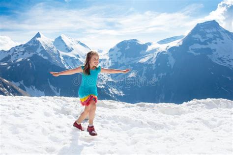 Child Hiking In Mountains Kids In Snow In Spring Stock Image Image