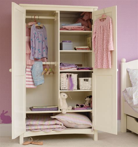 This kids wardrobe design looks like two wardrobes joined together to make it one. Junior Rooms | Cupboard design, Bedroom cupboard designs ...