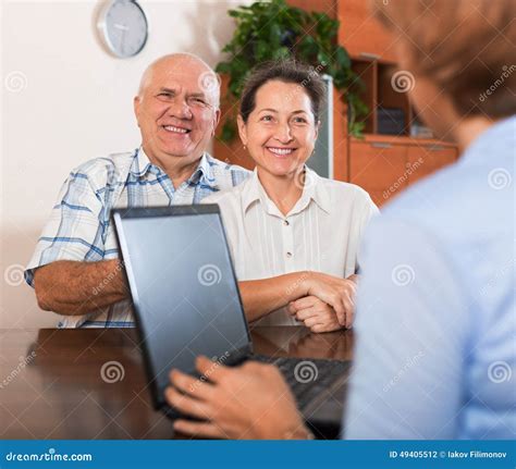 Mature Couple Answer Questions Of Outreach Worker Stock Photo Image