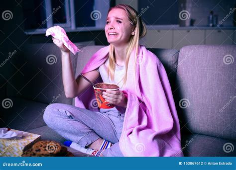 Young Woman Watching Movie At Night Emotional Model Sitting On Sofa