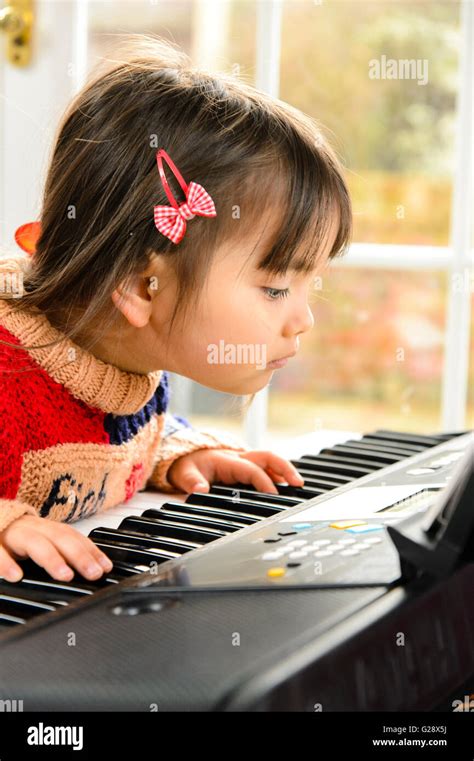 Kid Playing Piano Stock Photo Alamy