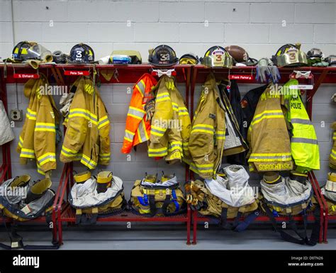 Fire Department Gear Hanging In A Firehouse Stock Photo Alamy