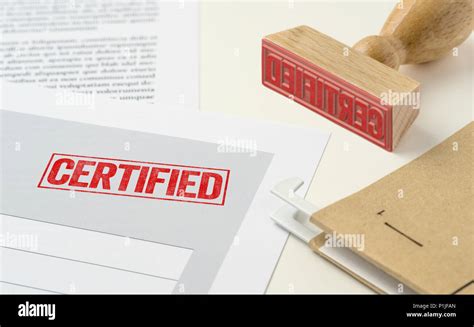 A Red Stamp On A Document Certified Stock Photo Alamy