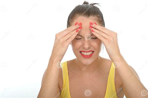 Stressed Young Woman Sitting On The Floor Rubbing Her Forehead Stock