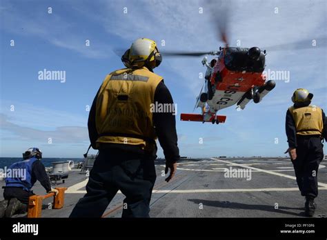 A Coast Guard Mh 60 Jayhawk Helicopter Aircrew Conducts A Series Of