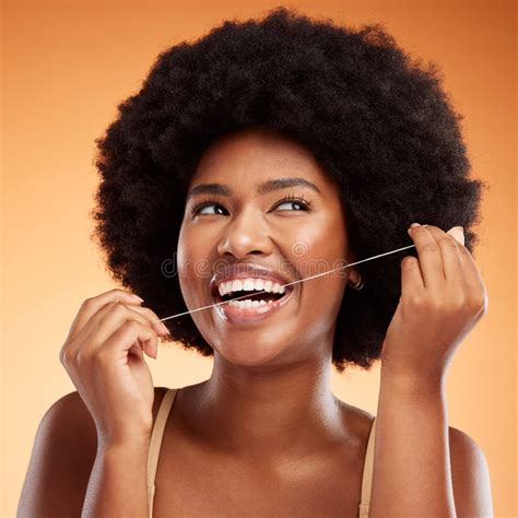 Flossing Dental And Black Woman Cleaning Teeth Against An Orange