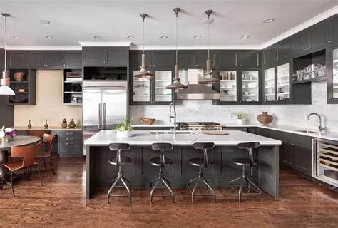 Contemporary Kitchen With Dark Gray Cabinets White Quartz Countertops Pendant Lights Wood Flooring 