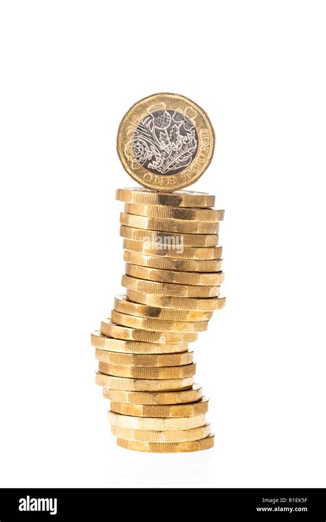 Uk British Pound Coin On Top Of Stack Of Coins With White Background