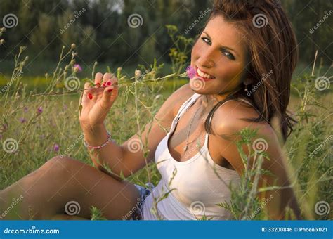 Girl Lying In The Grass Smelling Flower Stock Photo Image Of Flower