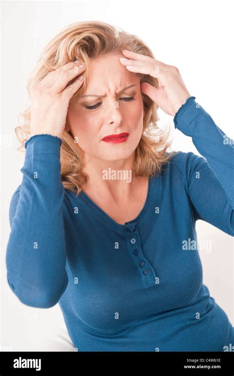 Woman Holding Her Head Stock Photo Alamy