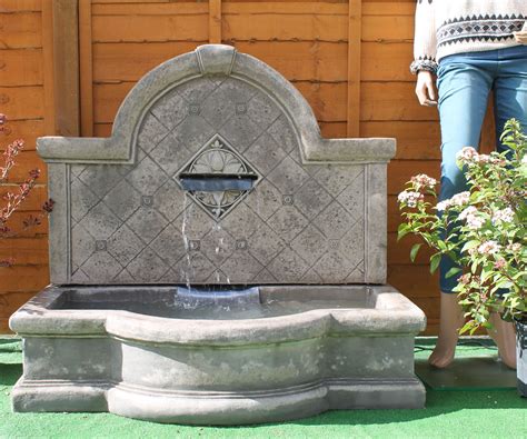 Ornaments & garden art / wall art. Tapas Wall Fountain - Stone Garden Ornaments & Garden ...