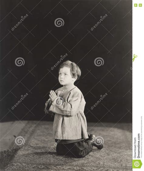 Little Boy Kneeling In Prayer Stock Image Image Of 1910s1940s