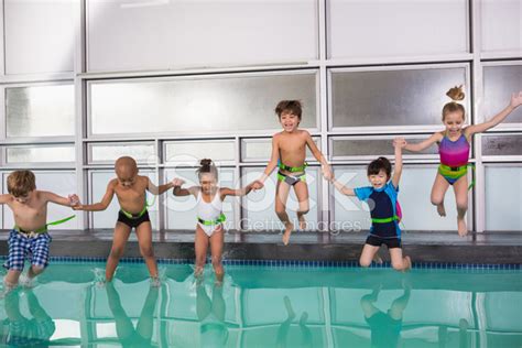 Cute Swimming Class Jumping In The Pool Stock Photo Royalty Free