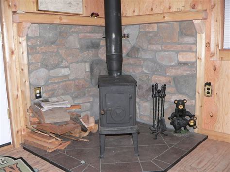 Hd00:11close up of an iron wood burning stove in a log cabin in the woods. Controlling heat from a cabin woodstove - Small Cabin ...
