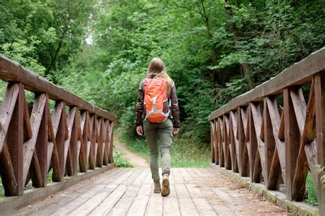 Premium Photo Girl With A Backpack On A Bridge Travel