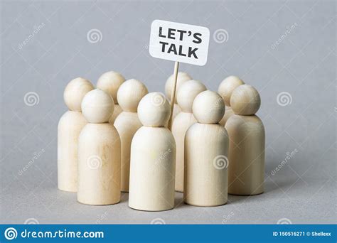 Small Wooden Figures With A `Let`s Talk` Poster Stock Image - Image of ...
