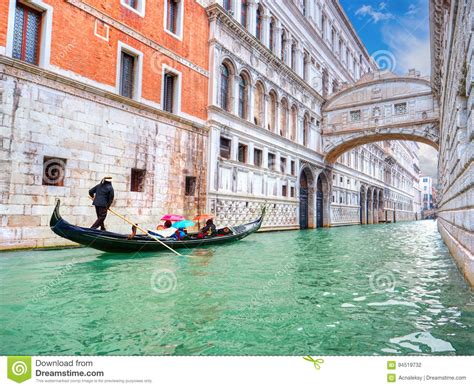 Traditional Gondola And The Famous Bridge Of Sighs In Venice Editorial